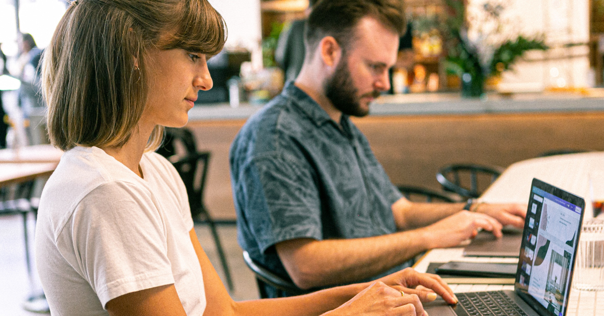 bannrer of man and woman with laptop