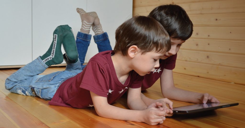 picture of two kids with tablet
